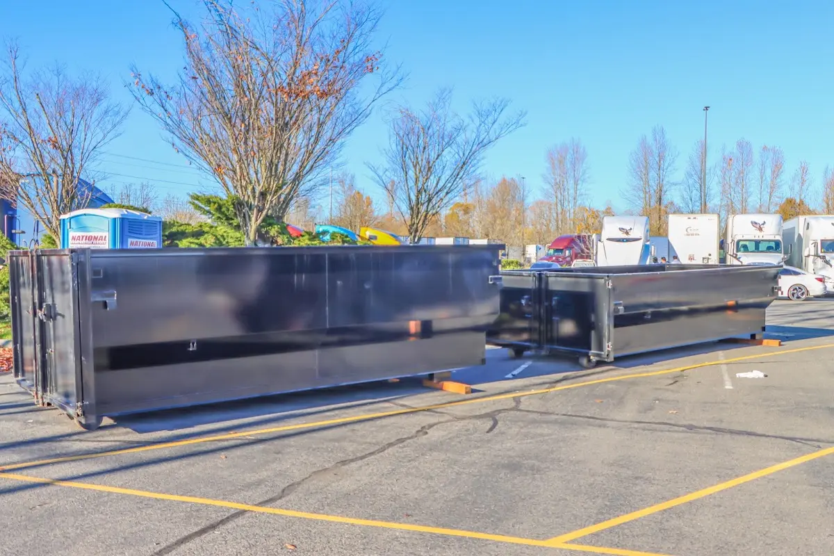 Professional dumpster rental service with roll-off container on residential driveway in Solvang